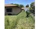 Grassy backyard featuring a partial chain link fence at 13111 Sheridan Dr, Hudson, FL 34667