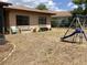 Backyard featuring grass and a playset at 13111 Sheridan Dr, Hudson, FL 34667