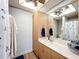 Bathroom features a vanity with a mirror, ample storage, and modern fixtures, providing a functional and stylish space at 13111 Sheridan Dr, Hudson, FL 34667