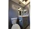 Renovated bathroom featuring neutral walls, marble countertop, and light-colored cabinets at 13111 Sheridan Dr, Hudson, FL 34667