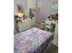 Bedroom with lavender walls, hardwood floors, and a storage bed at 13111 Sheridan Dr, Hudson, FL 34667