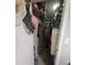 Walk in closet with wire rack shelving and clothing storage, and a door partially open at 13111 Sheridan Dr, Hudson, FL 34667