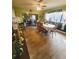 Open dining room space with large windows and tile flooring providing generous natural light at 13111 Sheridan Dr, Hudson, FL 34667