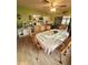 Open dining space showcases tile floors and connects to the kitchen for seamless entertaining at 13111 Sheridan Dr, Hudson, FL 34667