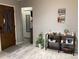 Inviting entryway featuring light tile floors and a decorative console table creating a warm and welcoming atmosphere at 13111 Sheridan Dr, Hudson, FL 34667