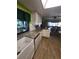 Modern kitchen featuring white cabinets, granite countertops, and stainless steel appliances at 13111 Sheridan Dr, Hudson, FL 34667