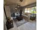 Spacious living room with neutral color palette, featuring comfortable seating and a ceiling fan, ideal for relaxation at 13111 Sheridan Dr, Hudson, FL 34667