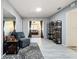 Bright living room with stylish decor, gray walls, and a skylight at 13111 Sheridan Dr, Hudson, FL 34667