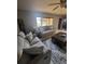 Living room with comfortable seating and bright natural light at 13111 Sheridan Dr, Hudson, FL 34667
