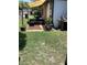 Cozy outdoor patio with comfortable seating, potted plants, shade and a grill perfect for relaxing at 13111 Sheridan Dr, Hudson, FL 34667