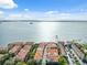 Stunning aerial view of waterfront condos with private boat docks and beautiful water views at 1340 Bayshore Blvd # 411, Dunedin, FL 34698