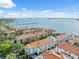 High angle showing rooftops of community buildings, roads, waterways, and parking at 1340 Bayshore Blvd # 411, Dunedin, FL 34698