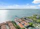 Beautiful aerial view showcasing waterfront condo community with boat docks along the water at 1340 Bayshore Blvd # 411, Dunedin, FL 34698
