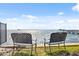 Backyard view featuring two metal benches, a waterfront, and a view of the horizon at 1340 Bayshore Blvd # 411, Dunedin, FL 34698