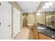 Primary bathroom featuring double sinks, a soaking tub, a glass enclosed shower, and tile flooring at 1340 Bayshore Blvd # 411, Dunedin, FL 34698