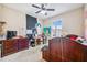 Bedroom featuring a red-toned dresser, an unmade bed, and some artistic decor on the wall at 1340 Bayshore Blvd # 411, Dunedin, FL 34698