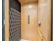 Interior view of the elevator featuring wood paneling and safety gate at 1340 Bayshore Blvd # 411, Dunedin, FL 34698
