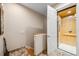 Hallway view showing a personal elevator with a wood paneled interior and tile flooring on the landing at 1340 Bayshore Blvd # 411, Dunedin, FL 34698