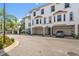 Exterior shot showcasing well-manicured landscaping, a gated entrance and beautiful curb appeal at 1340 Bayshore Blvd # 411, Dunedin, FL 34698
