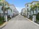 Elegant gated community entrance with palm trees and well-maintained landscaping at 1340 Bayshore Blvd # 411, Dunedin, FL 34698