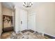Foyer with tile flooring, coat rack, bench, and access to other rooms at 1340 Bayshore Blvd # 411, Dunedin, FL 34698