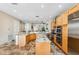 Spacious kitchen with stainless steel appliances, custom cabinets, and an island with granite countertops at 1340 Bayshore Blvd # 411, Dunedin, FL 34698