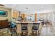Spacious kitchen featuring a large island, breakfast bar, stainless steel appliances, and an adjacent dining area at 1340 Bayshore Blvd # 411, Dunedin, FL 34698