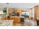 Well-equipped kitchen with stainless steel appliances, custom cabinets, and a central island with a wine cooler at 1340 Bayshore Blvd # 411, Dunedin, FL 34698