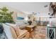 Open concept living room with tile floors, comfortable seating, modern decor, and view of the kitchen at 1340 Bayshore Blvd # 411, Dunedin, FL 34698
