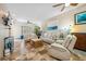 Bright living room featuring tile floors, comfortable seating, ceiling fans, and modern decor at 1340 Bayshore Blvd # 411, Dunedin, FL 34698