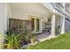 Outdoor patio with privacy screen, plants, and access to living space at 1340 Bayshore Blvd # 411, Dunedin, FL 34698