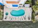 Aerial view of waterfront condo complex community pool and hot tub with chaise lounges at 1340 Bayshore Blvd # 411, Dunedin, FL 34698