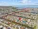 Stunning aerial view of waterfront home, highlighting access to canals, bay and surrounding community at 13632 Britton Dr, Hudson, FL 34667
