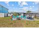 Backyard with patio seating around a fire pit, ideal for cozy outdoor gatherings and relaxing moments at 13632 Britton Dr, Hudson, FL 34667