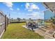 Lush backyard with canal views, patio seating, and plenty of space for outdoor enjoyment at 13632 Britton Dr, Hudson, FL 34667