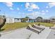 Enjoy the backyard with lounge chairs, patio, grill, and storage shed, perfect for outdoor living at 13632 Britton Dr, Hudson, FL 34667