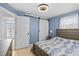 Charming bedroom with a sliding barn door and ample natural light from the exterior window at 13632 Britton Dr, Hudson, FL 34667