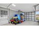 Spacious garage filled with belongings and ready for storage or a workspace at 13632 Britton Dr, Hudson, FL 34667
