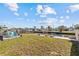 Backyard with canal access and dock, perfect for boating and enjoying waterfront living at 13632 Britton Dr, Hudson, FL 34667