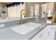 Modern kitchen sink with stainless steel faucet and granite countertops at 13942 Talmage Loop, Hudson, FL 34667