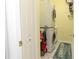 Functional laundry room with stacked washer and dryer at 13942 Talmage Loop, Hudson, FL 34667