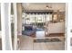 Spacious living room featuring a tray ceiling and views to the lanai at 13942 Talmage Loop, Hudson, FL 34667