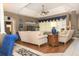 Open living room showcases modern decor, comfortable seating, and a tray ceiling at 13942 Talmage Loop, Hudson, FL 34667