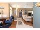 Open concept living and dining area with hardwood flooring and neutral paint at 13942 Talmage Loop, Hudson, FL 34667