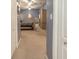 Spacious main bedroom featuring carpet floors, a large closet, and a ceiling fan at 13942 Talmage Loop, Hudson, FL 34667