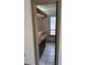 Hall bathroom featuring a vanity with sink, storage cabinets, a large mirror, and neutral toned tiled floor at 1412 Wexford N Dr, Palm Harbor, FL 34683