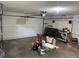 Spacious garage with a roll-up door and ample storage and work space at 1412 Wexford N Dr, Palm Harbor, FL 34683