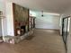 Open living room with fireplace, hardwood floor, ceiling fan and abundant light from windows at 1412 Wexford N Dr, Palm Harbor, FL 34683