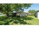 A shady backyard provides ample lawn space and room to relax at 15038 Tamarind Loop, Spring Hill, FL 34609