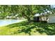Expansive backyard overlooking a serene pond, perfect for outdoor enjoyment at 15038 Tamarind Loop, Spring Hill, FL 34609